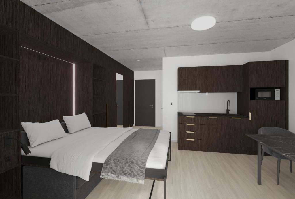 una camera con un grande letto e un tavolo di MOOI Apartments St.Gallen a St. Gallen