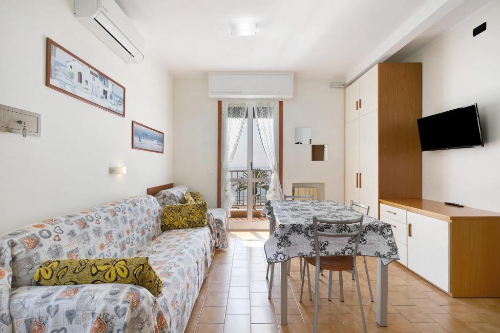 a living room with a couch and a table at Numero 7 in Borgio Verezzi