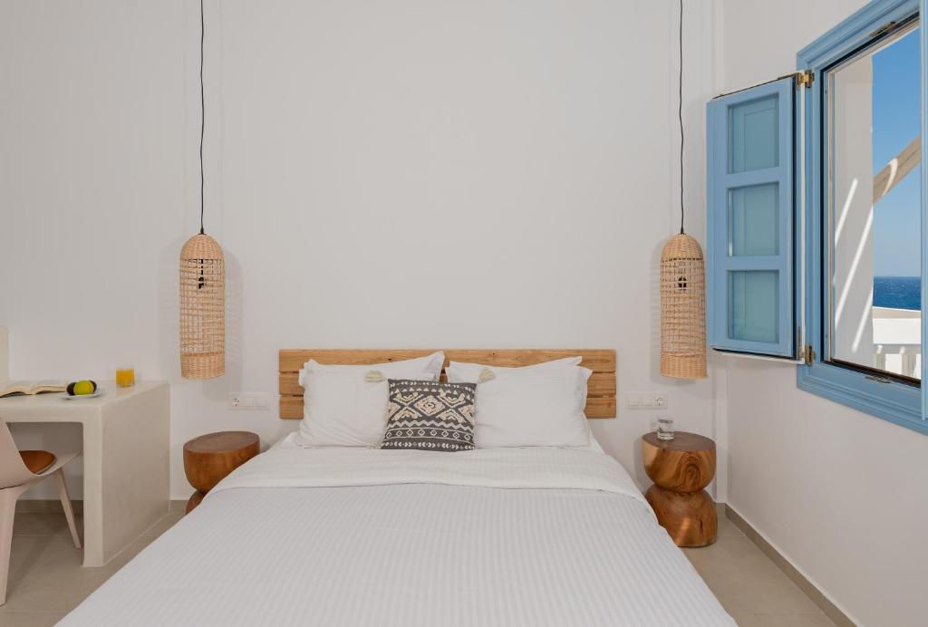 Postel nebo postele na pokoji v ubytování Ihthioessa Boutique Hotel