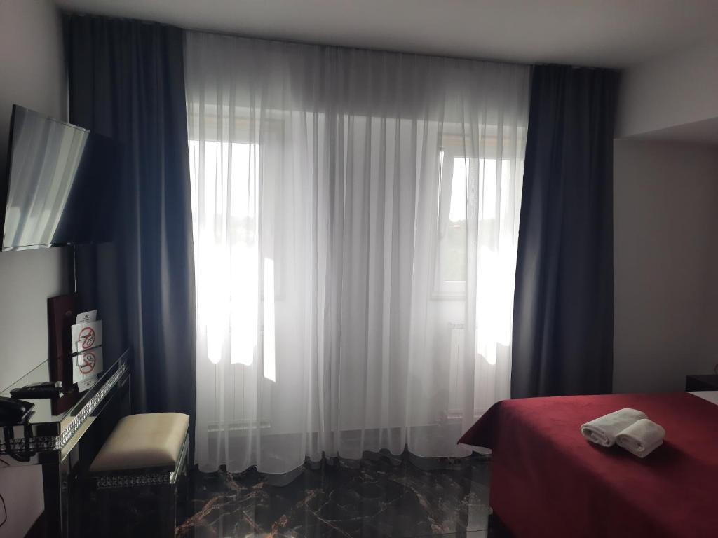 Postel nebo postele na pokoji v ubytování Hotel Prunk