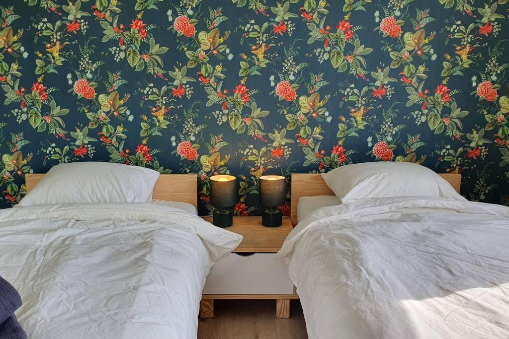 Ein Bett oder Betten in einem Zimmer der Unterkunft D'Hestia - Gîte avec vue imprenable sur Huy