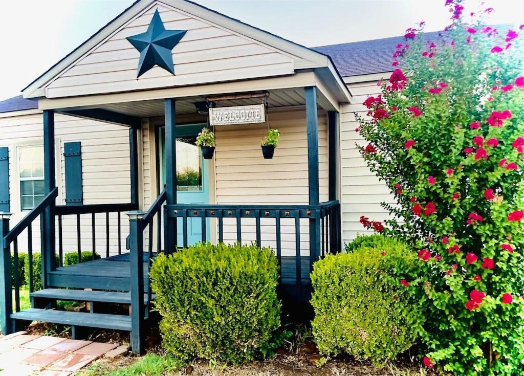 a house with a star on the front of it at Farm Charm 