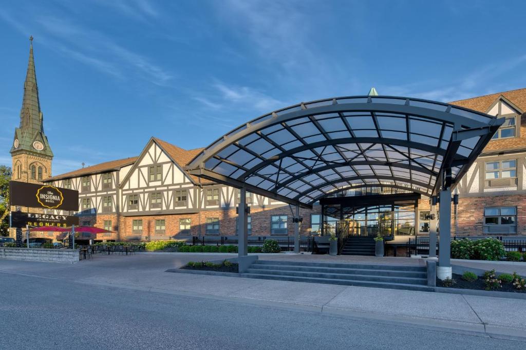 a building with a metal structure in front of a street at The Insignia Hotel, Sarnia, a Tribute Portfolio Hotel in Sarnia