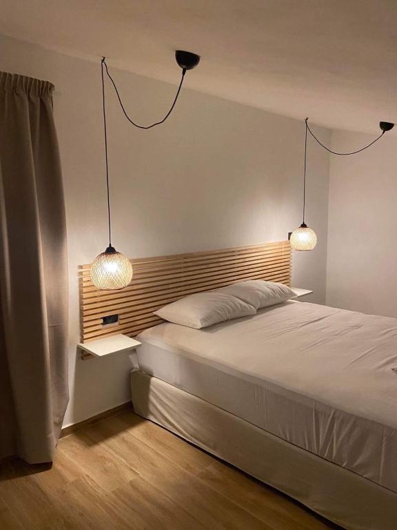 Postel nebo postele na pokoji v ubytování OLIVOMARE