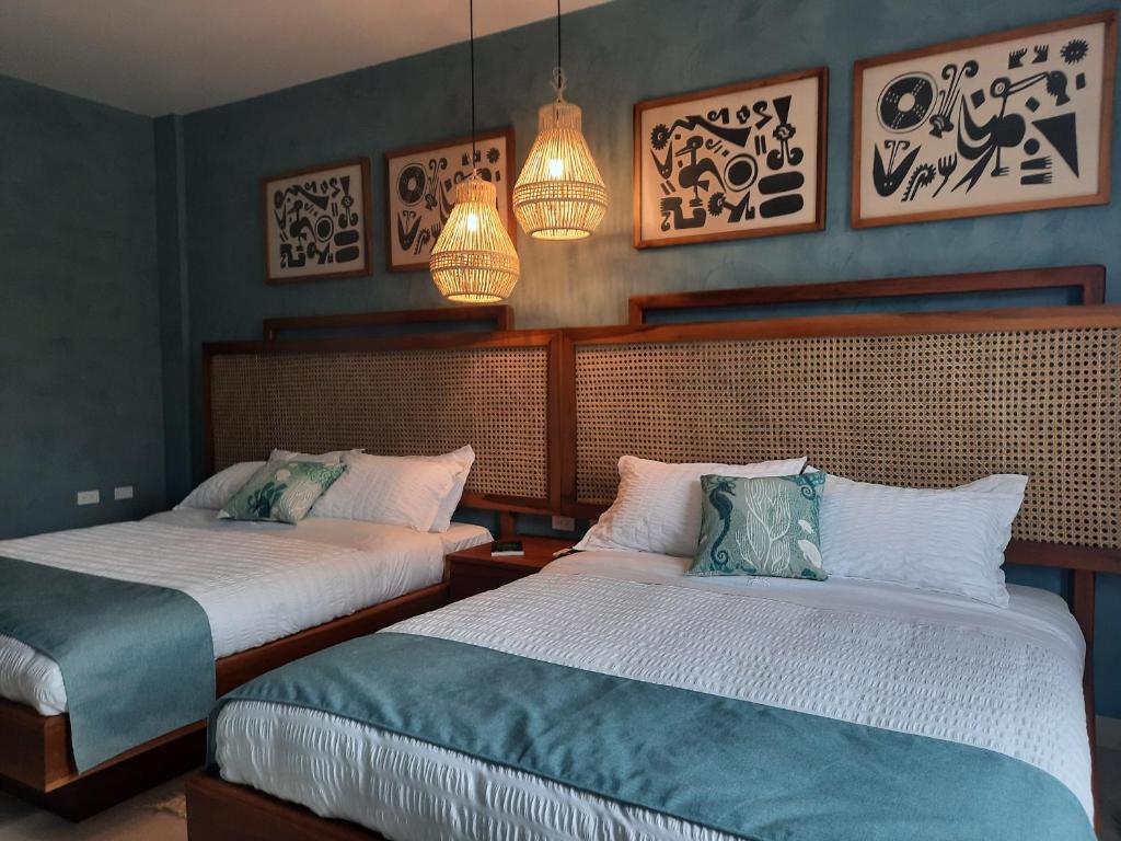 Postel nebo postele na pokoji v ubytování Jama Campay - Homes Resort & Spa