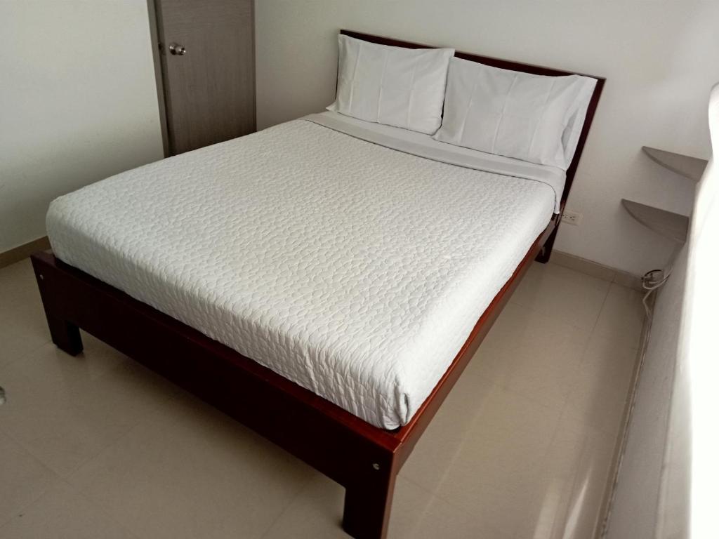 Postel nebo postele na pokoji v ubytování Stay In Bogota