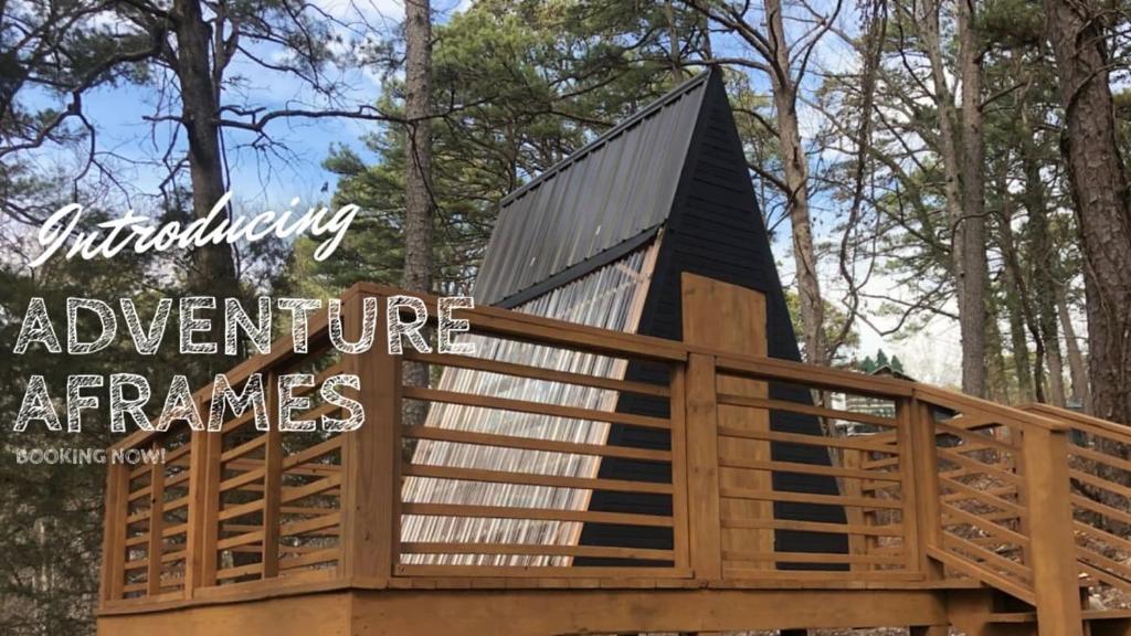 a tree house with a gambrel roof at Loblolly Pines Adventure Aframe #2 in Eureka Springs