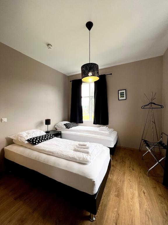 Postel nebo postele na pokoji v ubytování Bjork Guesthouse