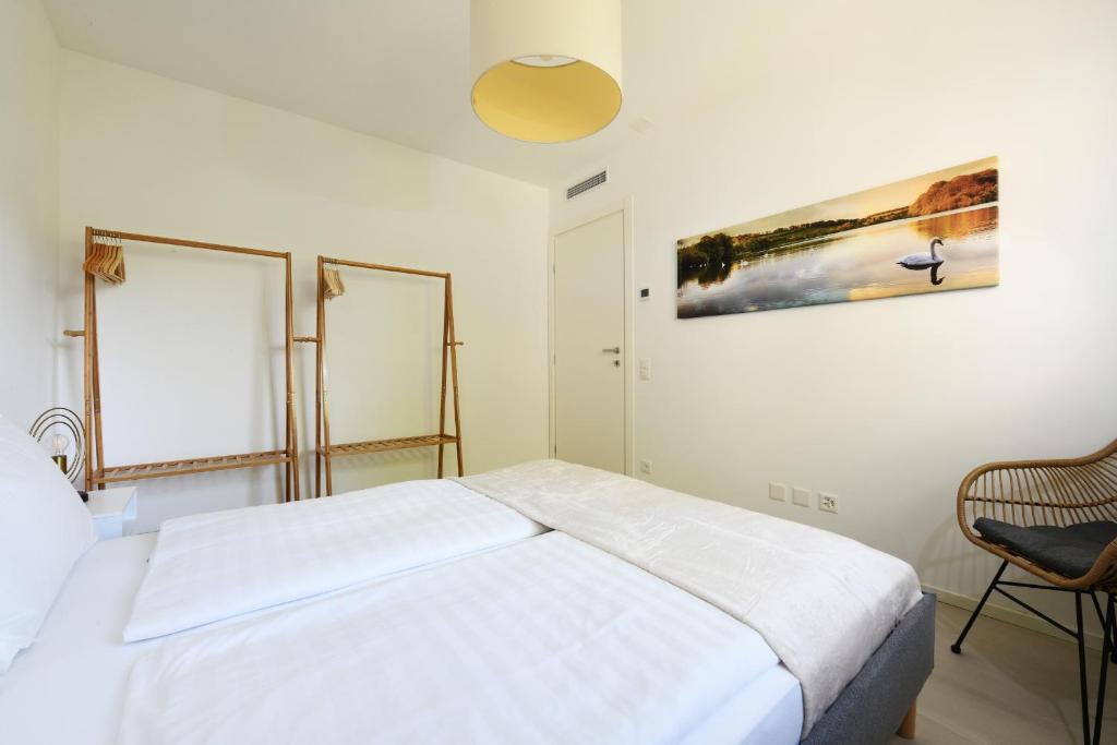Una cama o camas en una habitación de Sans Souci 2