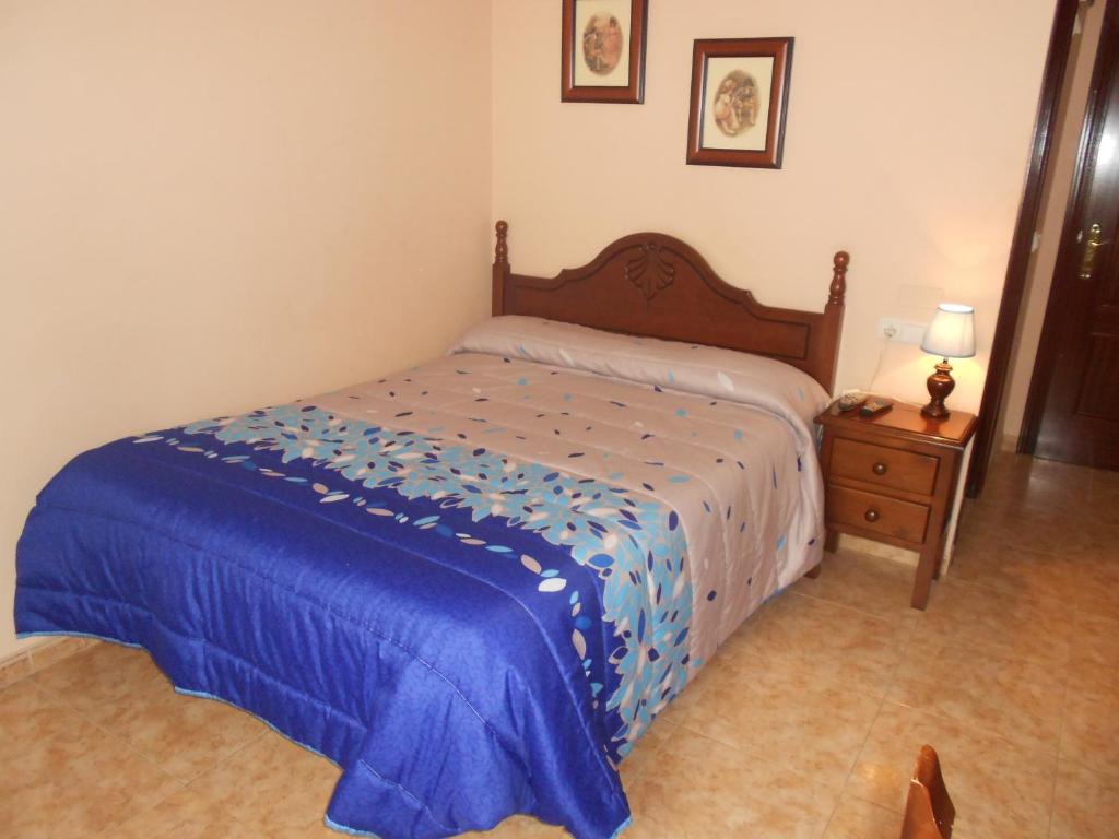 Postel nebo postele na pokoji v ubytování Hostal El Polígono