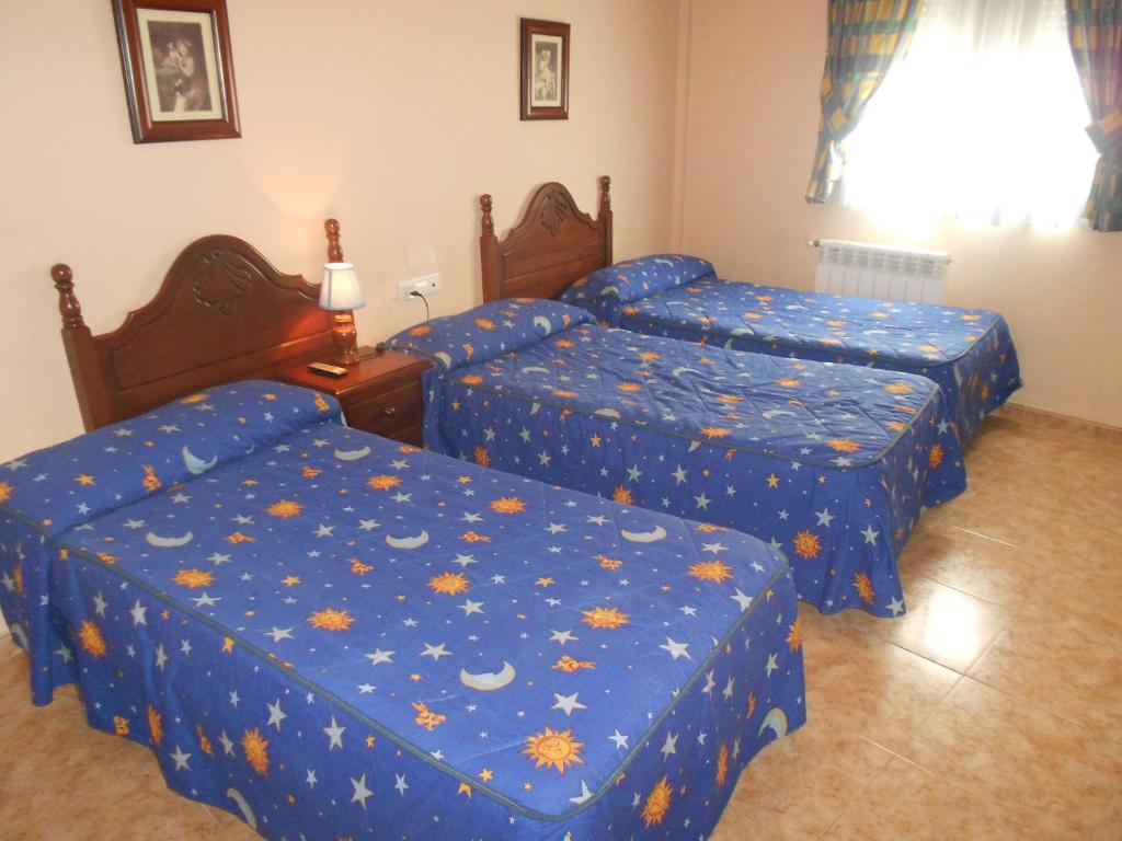 Postel nebo postele na pokoji v ubytování Hostal El Polígono