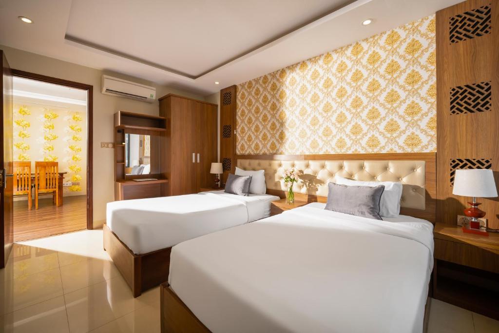 Postel nebo postele na pokoji v ubytování 7 Seven Sea Hotel