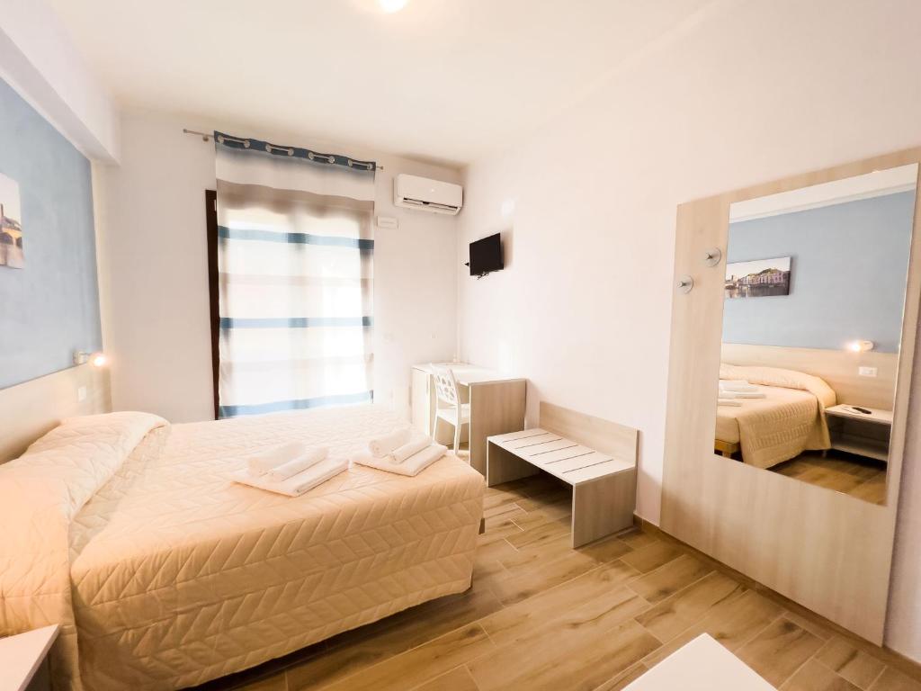 Postel nebo postele na pokoji v ubytování B&B BABBU MEU