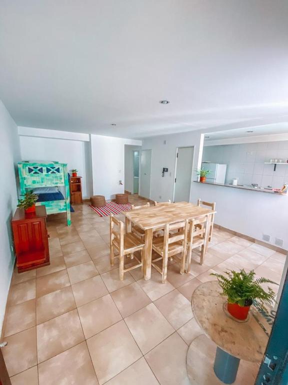 a living room with a wooden table and a couch at Cornejo Temporarios in Salta