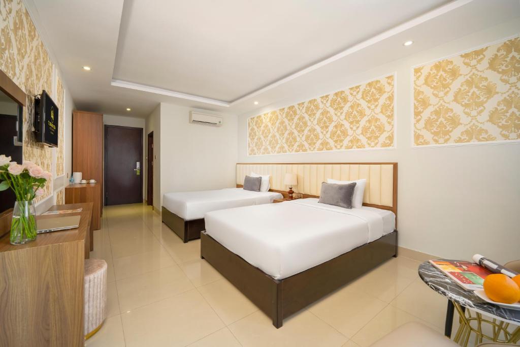 Postel nebo postele na pokoji v ubytování 7 Seven Sea Hotel