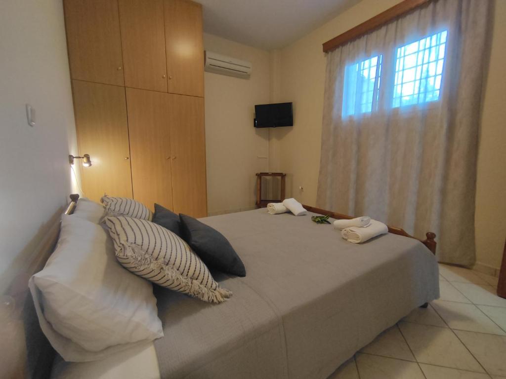 Postel nebo postele na pokoji v ubytování Bouka Apartment