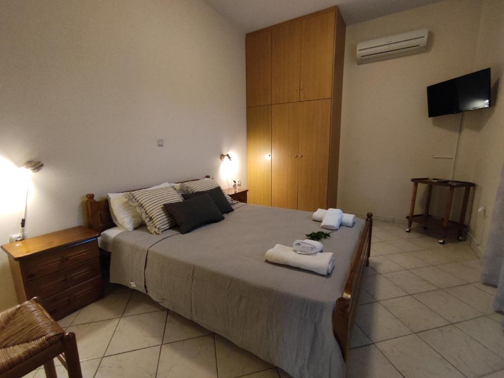 Postel nebo postele na pokoji v ubytování Bouka Apartment