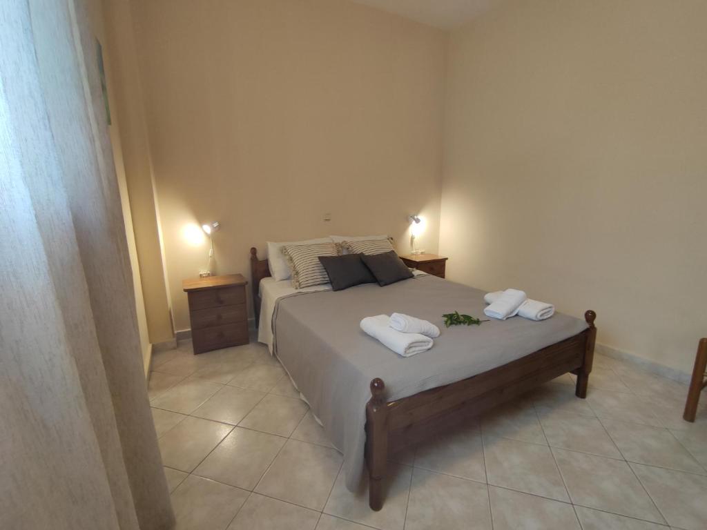 Postel nebo postele na pokoji v ubytování Bouka Apartment