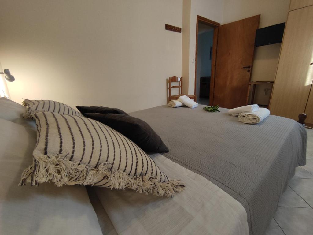 Postel nebo postele na pokoji v ubytování Bouka Apartment