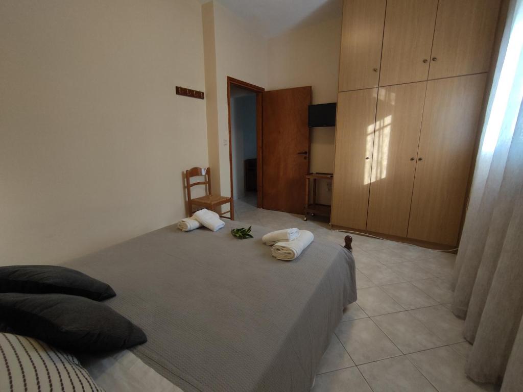 Postel nebo postele na pokoji v ubytování Bouka Apartment