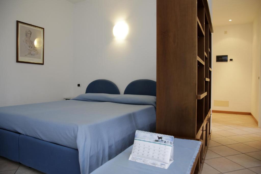 Postel nebo postele na pokoji v ubytování Residence Antico Crotto