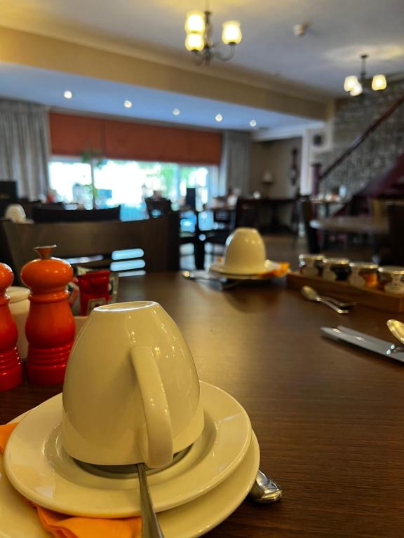 a hat sitting on top of a table at Queenswood Hotel in Weston-super-Mare