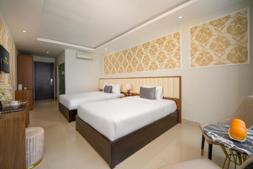 Postel nebo postele na pokoji v ubytování 7 Seven Sea Hotel
