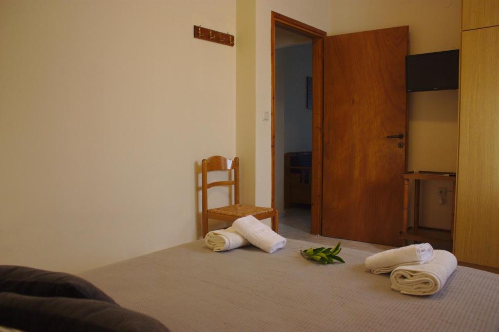 Postel nebo postele na pokoji v ubytování Bouka Apartment