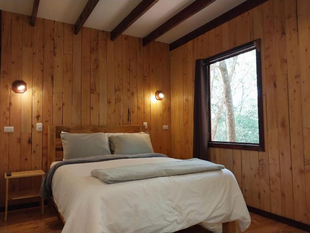 Postel nebo postele na pokoji v ubytování Curuba Lodge