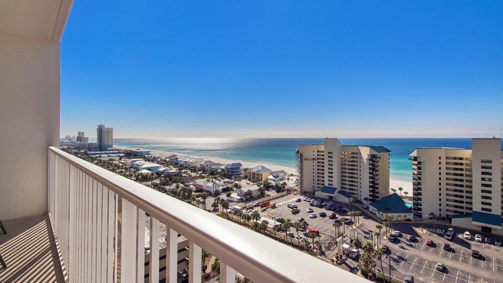 a balcony with a view of the beach and buildings at Laketown Wharf #1319 by Nautical Properties in Panama City Beach