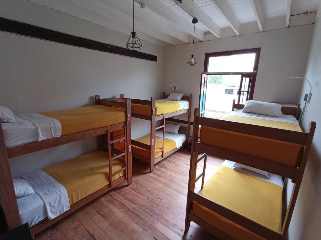 Postel nebo postele na pokoji v ubytování Flying Dog Lima B&B