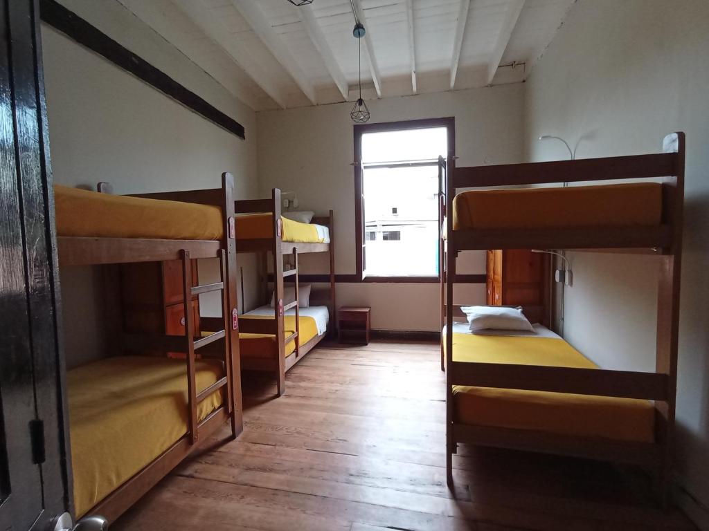 Postel nebo postele na pokoji v ubytování Flying Dog Lima B&B