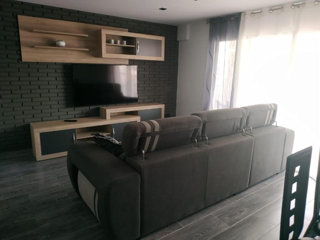 Televízia a/alebo spoločenská miestnosť v ubytovaní Cullera Relax