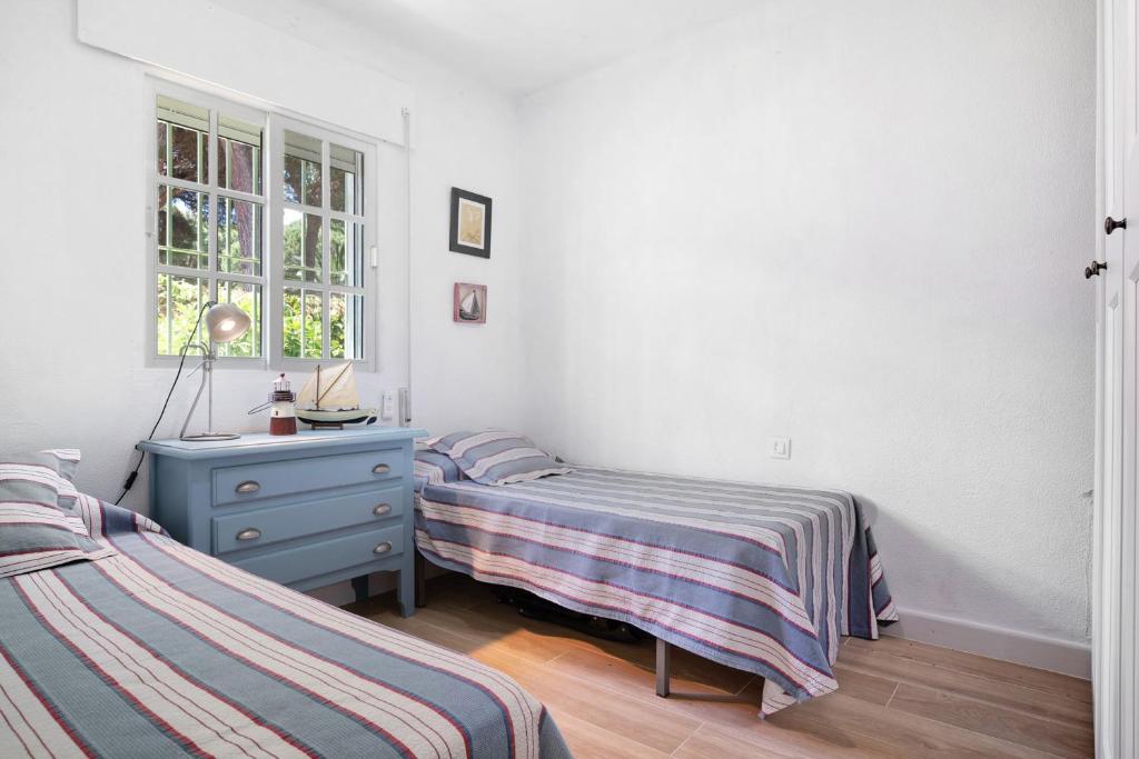 Postel nebo postele na pokoji v ubytování Villa Percebes