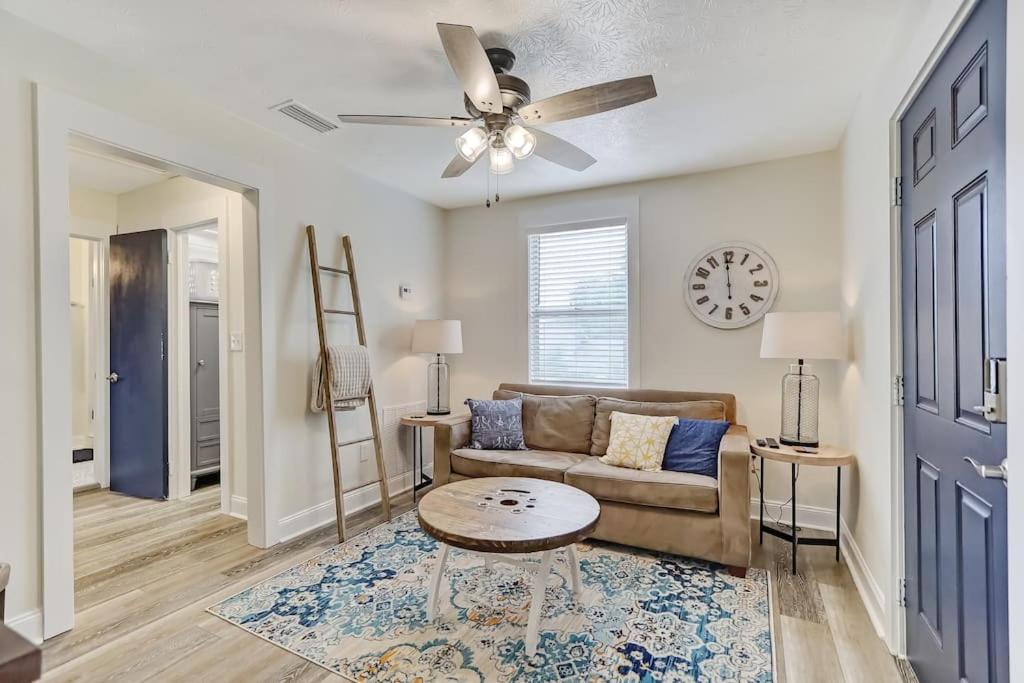 a living room with a couch and a table at Beautiful Stylish Home in Avondale Jacksonville in Jacksonville