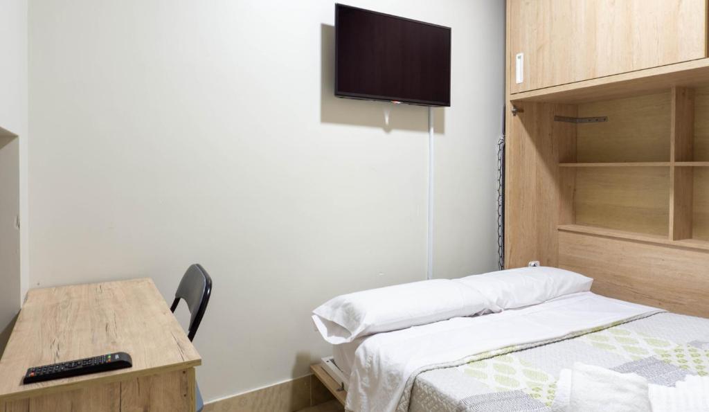 Posteľ alebo postele v izbe v ubytovaní San Juan Apartment Málaga Center