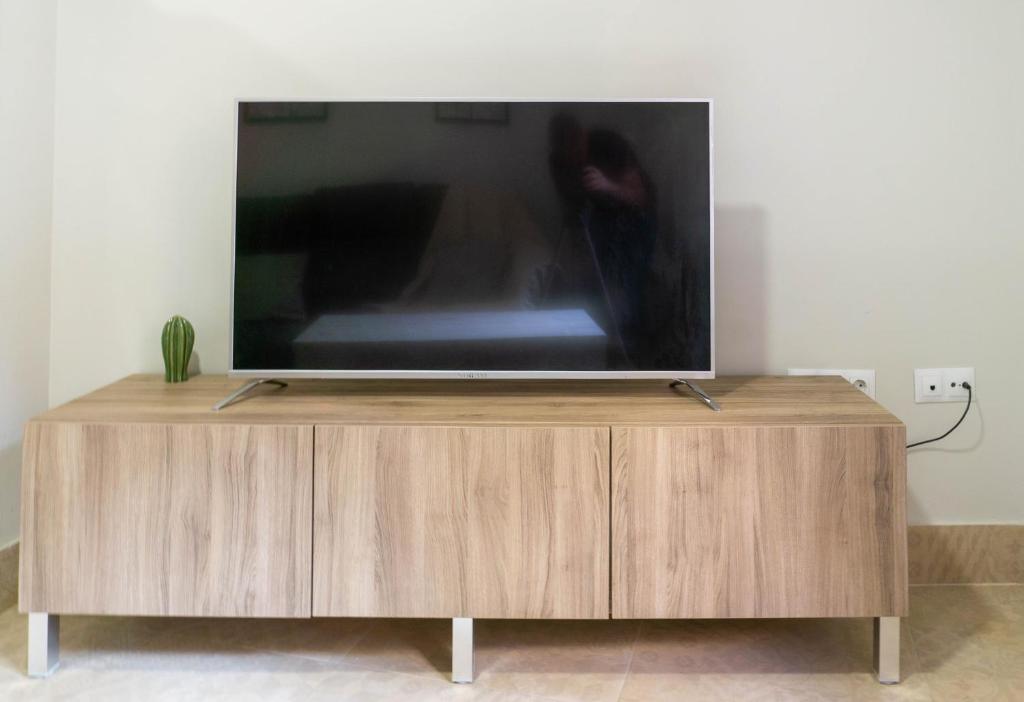 Televízia a/alebo spoločenská miestnosť v ubytovaní San Juan Apartment Málaga Center
