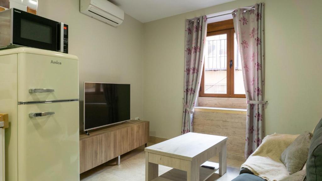 Televízia a/alebo spoločenská miestnosť v ubytovaní San Juan Apartment Málaga Center