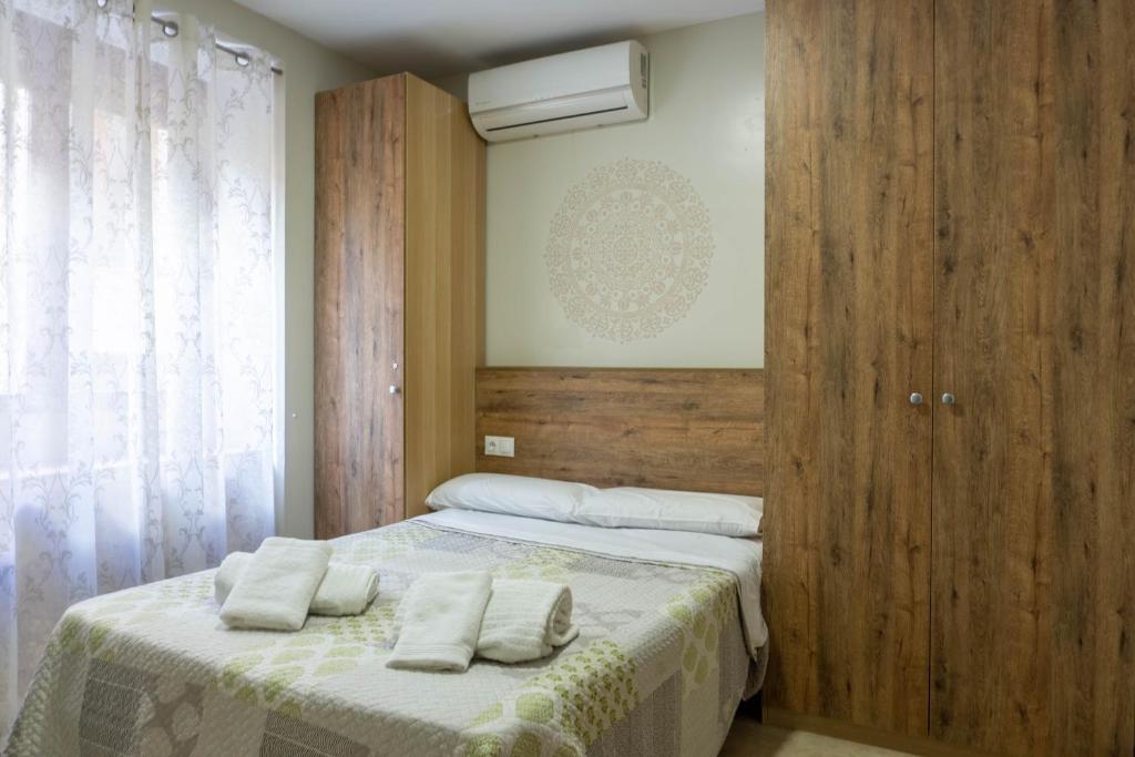 Posteľ alebo postele v izbe v ubytovaní San Juan Apartment Málaga Center