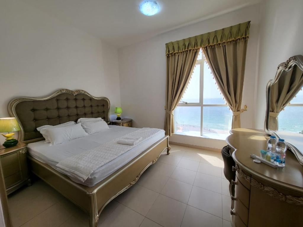 Postel nebo postele na pokoji v ubytování Beachfront Holiday Homes