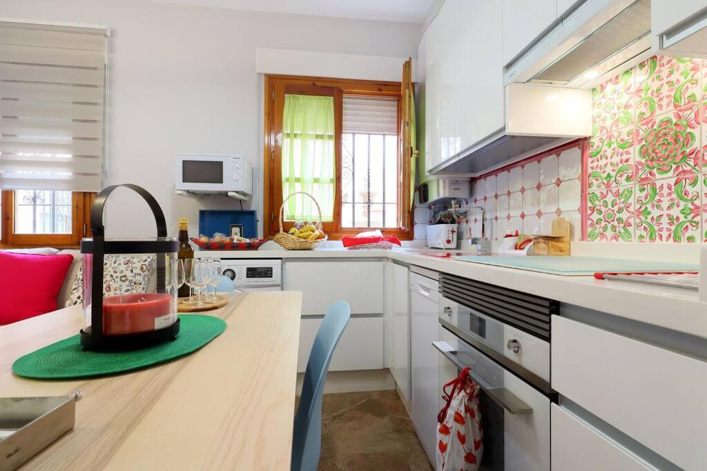 A kitchen or kitchenette at casa de los patios amurallados