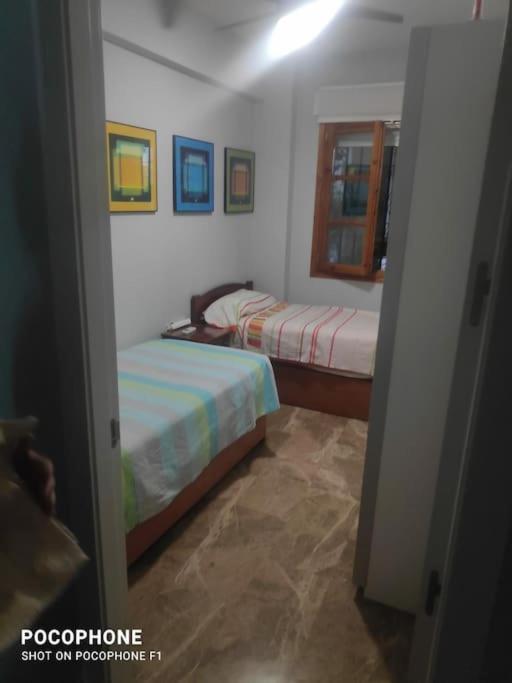 A bed or beds in a room at casa de los patios amurallados