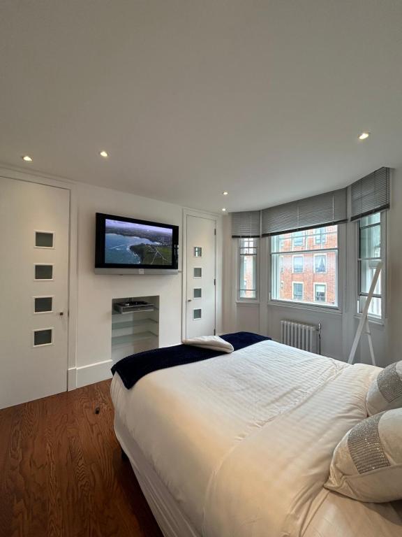 Giường trong phòng chung tại Lovely Central London Flat