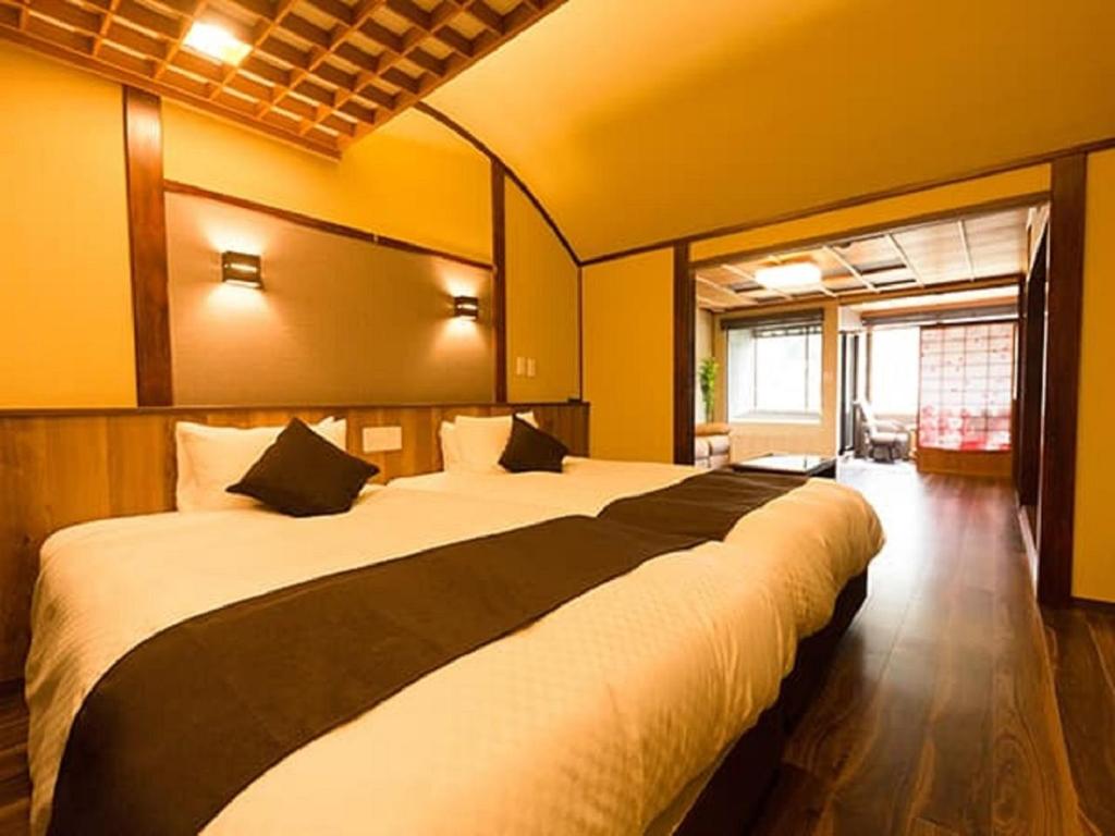 Postel nebo postele na pokoji v ubytování LiVEMAX RESORT Kawaji
