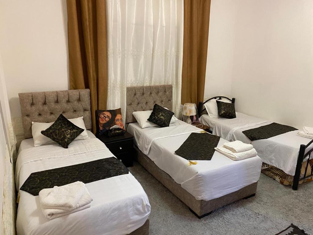 Postel nebo postele na pokoji v ubytování taila hostel