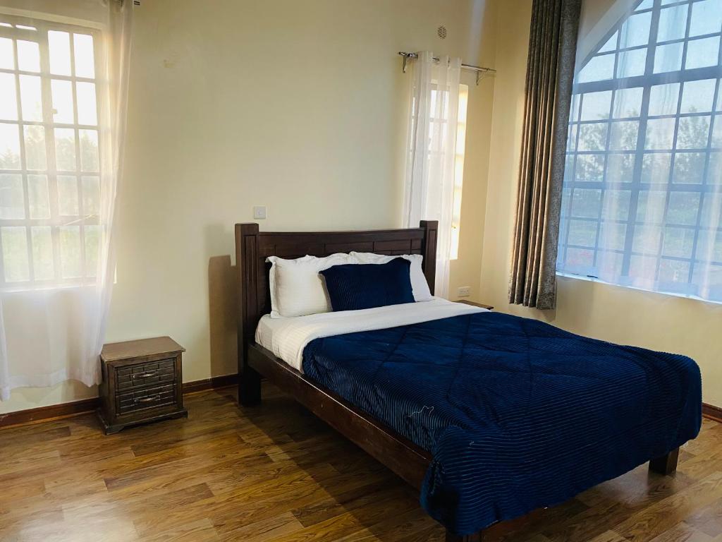 Postel nebo postele na pokoji v ubytování Lifestyle Villas, Nanyuki