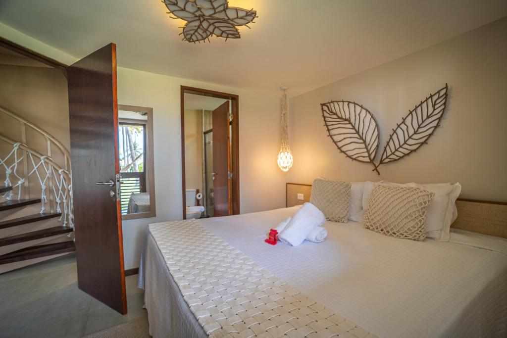 Postel nebo postele na pokoji v ubytování Pontal dos Carneiros Beach Bungalows