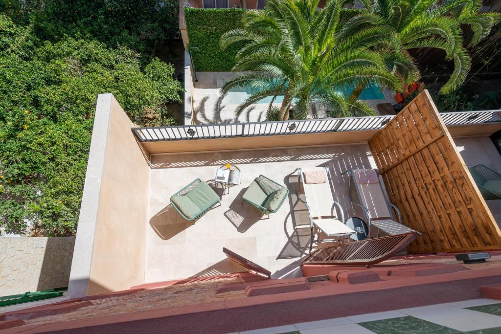 an image of a balcony with chairs and a pool at Hotel Can Quetglas in Palma de Mallorca