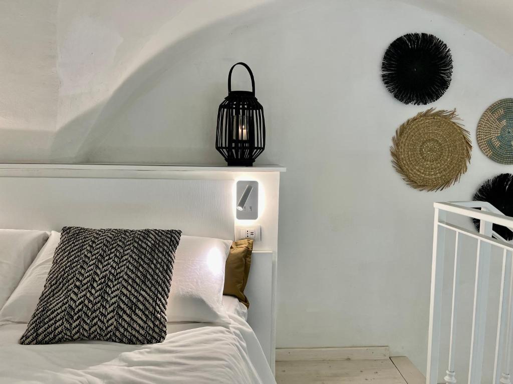 Кровать или кровати в номере CORTE DEI GOTHI - TREB Collection