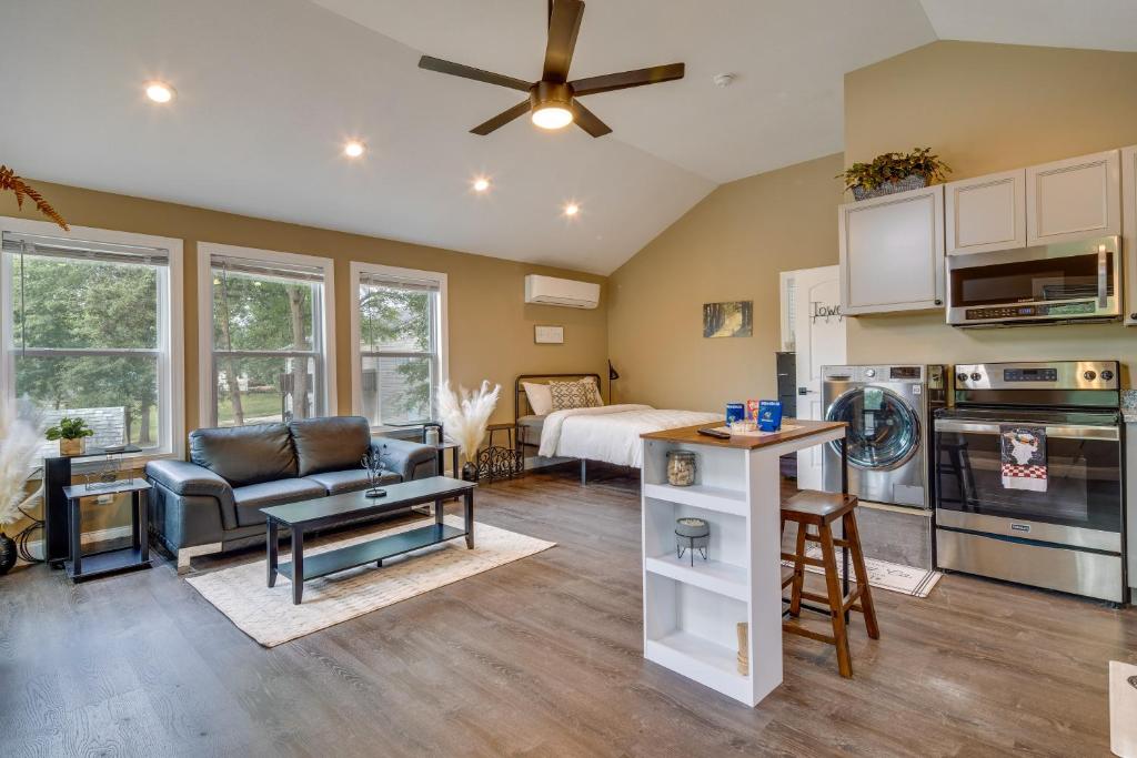 a living room with a couch and a ceiling fan at Peaceful Waterfront Studio 16 Mi to Greenville! in Simpsonville